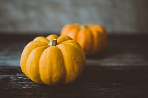 Two pumpkins on a table
